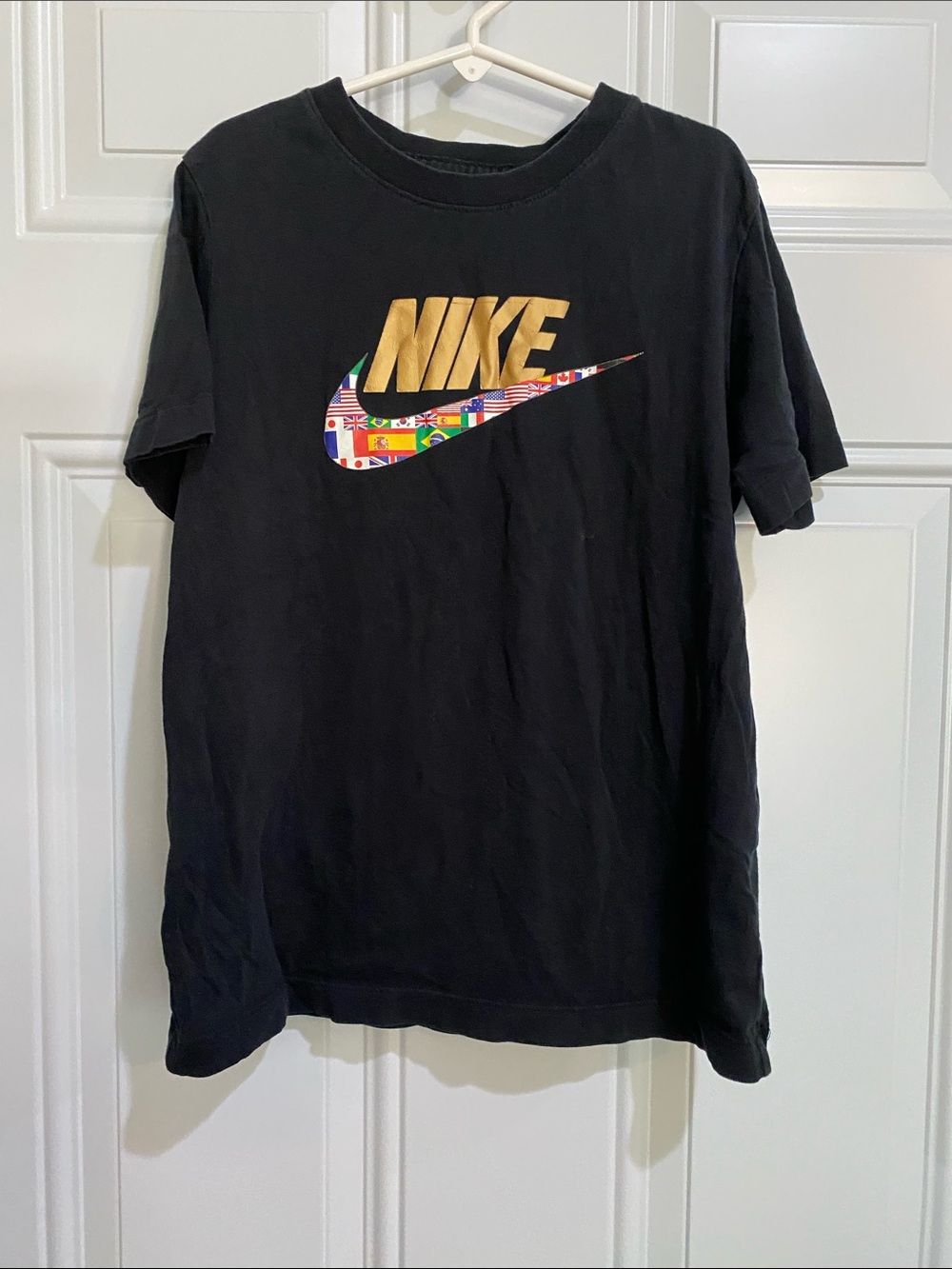 Nike Black Short Sleeve Tee with Gold Logo and Multicolor Flag Swoosh
